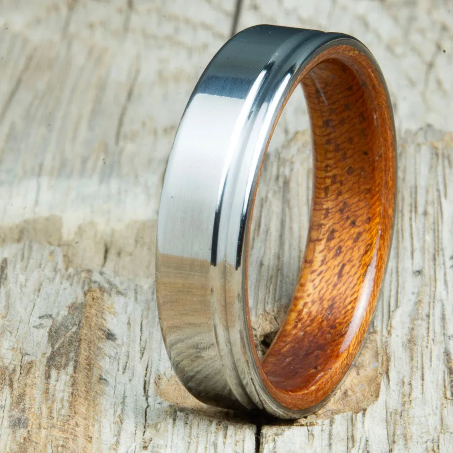 Polished titanium wedding band with Acacia interior