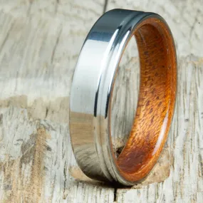 Polished titanium wedding band with Acacia interior